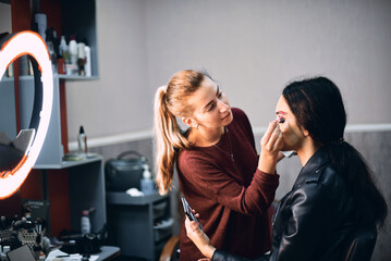 Professional Makeup Artist Creating a Bold Look