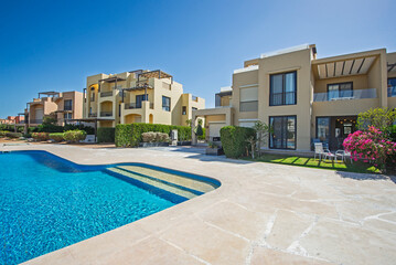 Outdoor swimming pool in a luxury tropical apartment resort