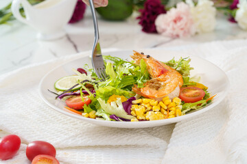 Mixed fruit and vegetable salad on a simple background