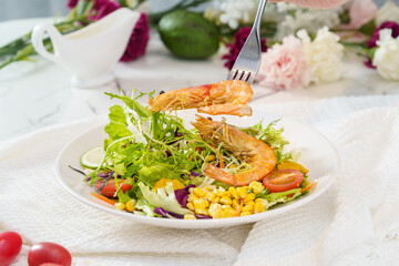 Mixed fruit and vegetable salad on a simple background