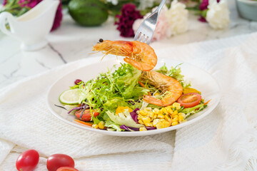 Mixed fruit and vegetable salad on a simple background