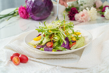 Mixed fruit and vegetable salad on a simple background