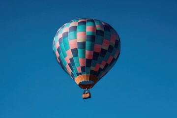 Naklejka premium vibrant hot air balloon floats gracefully against clear blue sky providing ample copy space ideal for travel or leisure