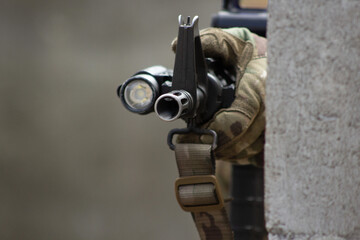 Close-Up of a Tactical Rifle with Flashlight Attachment
