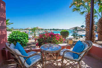 Patio terrace garden with chairs in tropical luxury apartment resort