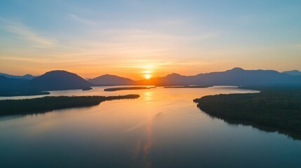 Fototapeta premium Breathtaking Aerial Panorama of Phang Nga Bay at Sunrise, Showcasing Majestic Mountains and Lush Rainforests in Thailand