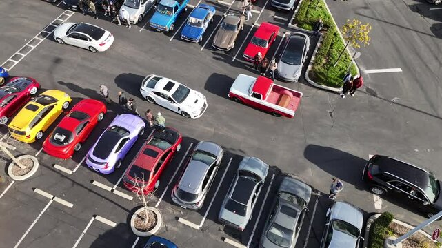 Drone footage of a car show in the city of Carson on a sunny day in Los Angeles, California, USA