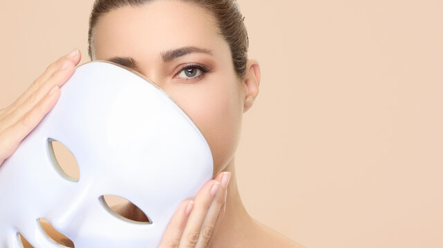 Beauty and skincare treatment featuring photon therapy light mask for skin rejuvenation with a focus on LED facial benefits