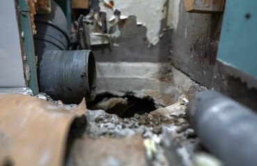 Disassembled sewer stack awaiting replacement with a new pipe.