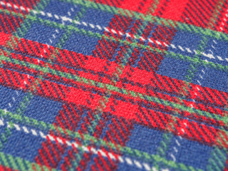 Vibrant fabric texture, rich with color, creates an eye-catching background. Detailed weave visible.