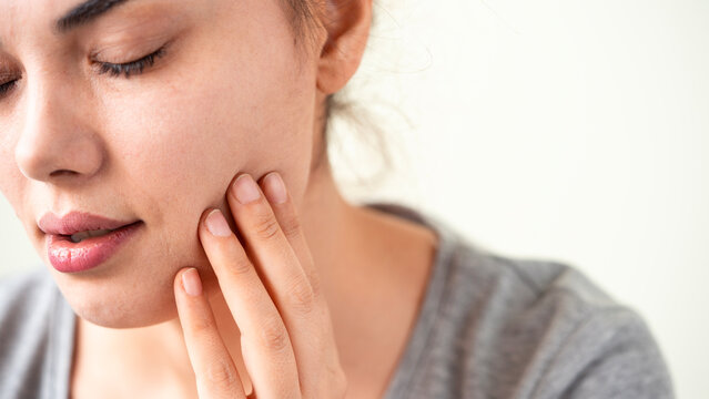 Young woman suffering from pain