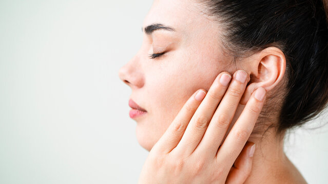 Young woman suffering from pain