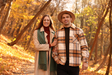 Fototapeta premium Happy couple spending time together in autumn park