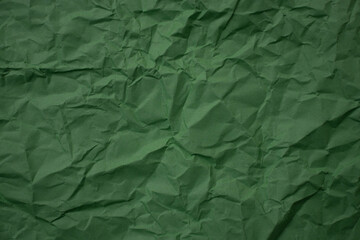 Dark green crumpled paper. Clean. Isolated.