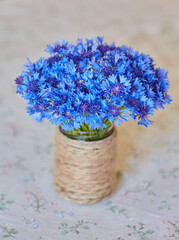 Blue Cornflowers in Rustic Vase