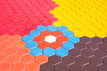 Stone hexagon brick blocks pavement floor background with colorful geometric pattern decoration on surface