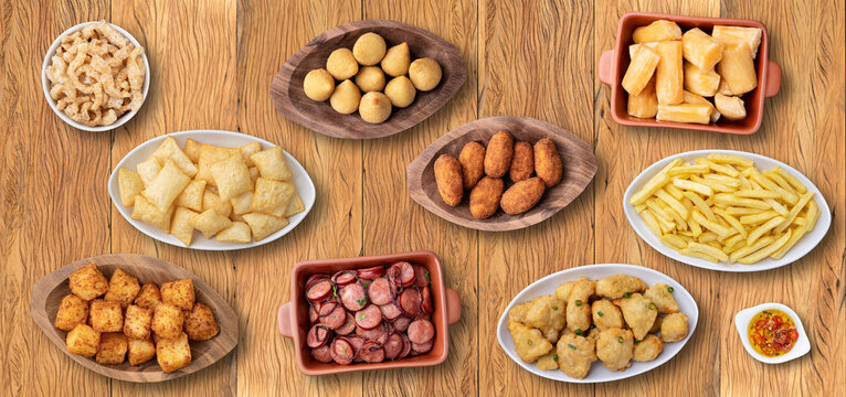 Assorted bar and pub food over wooden background