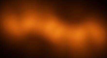 Naklejka premium Abstract orange and brown gradient texture with soft blurred lighting. 