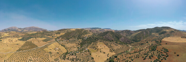 Countryside of Spain. Hills with agriculture. Olive tree farms. Fields of threshed wheat.  Beautiful landscape in South of Spain, Andaluc&iacute;a province.