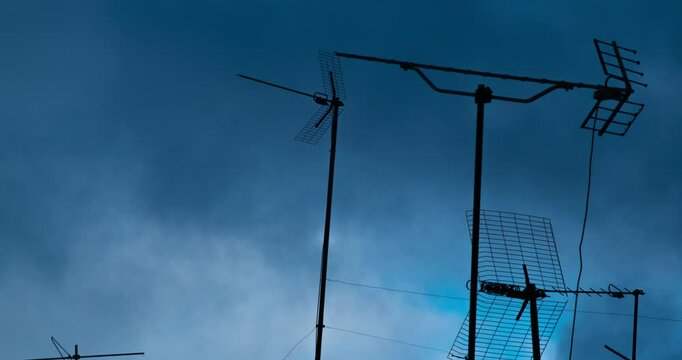 Clouds Passing By Over Building Antenas In The City