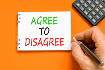 Agree to disagree symbol. Concept words Agree to disagree on beautiful white note. Beautiful orange...
