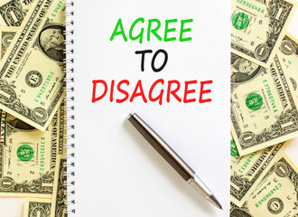 Agree to disagree symbol. Concept words Agree to disagree on beautiful white note. Dollar bills....