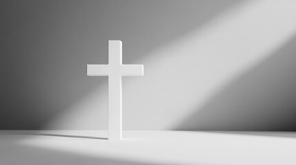 Minimalist white cross in sunlit space symbolizing faith and hope.
