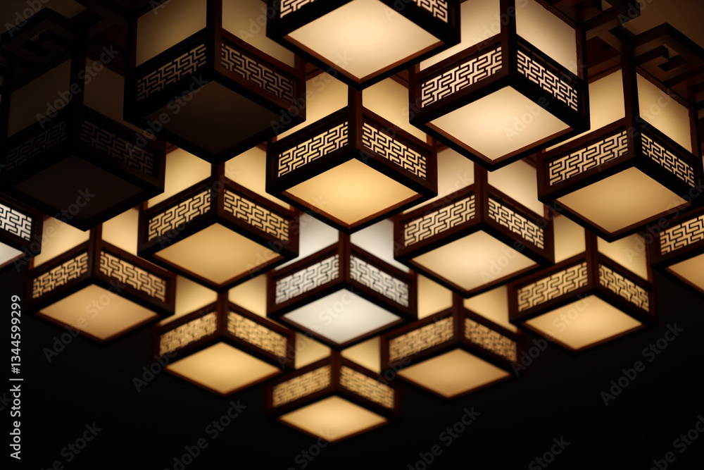 Poster a modern ceiling light fixture with multiple lights shining down.