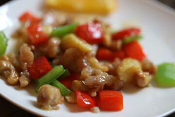 A plate filled with various meats and vegetables, perfect for a meal or buffet.
