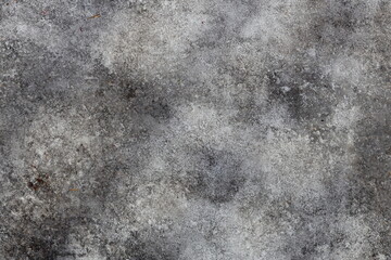 Close-up shot of a concrete surface covered in snow, ideal for winter-themed designs or architecture images.