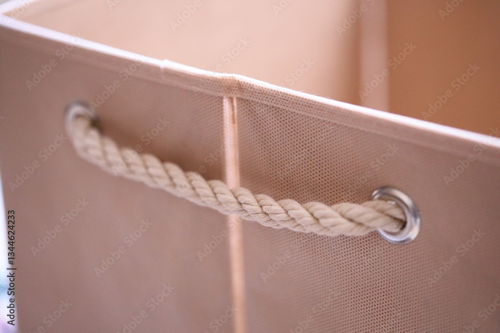 Poster a close-up view of a bag with a rope wrapped around it, suitable for outdoor or adventure-themed use