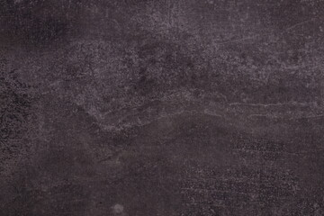 A person holding a tennis racket standing on a tennis court, ready to play.