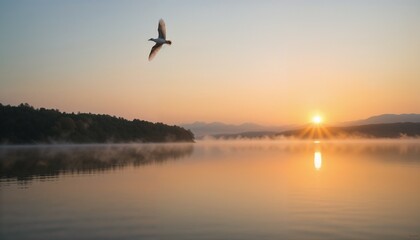 Sunrise over a misty lake with a bird soaring in the sky, casting a beautiful reflection on the calm water, creating a serene and peaceful atmosphere in the early morning light.