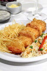 Fried and breaded prawns with Greek rice and French fries