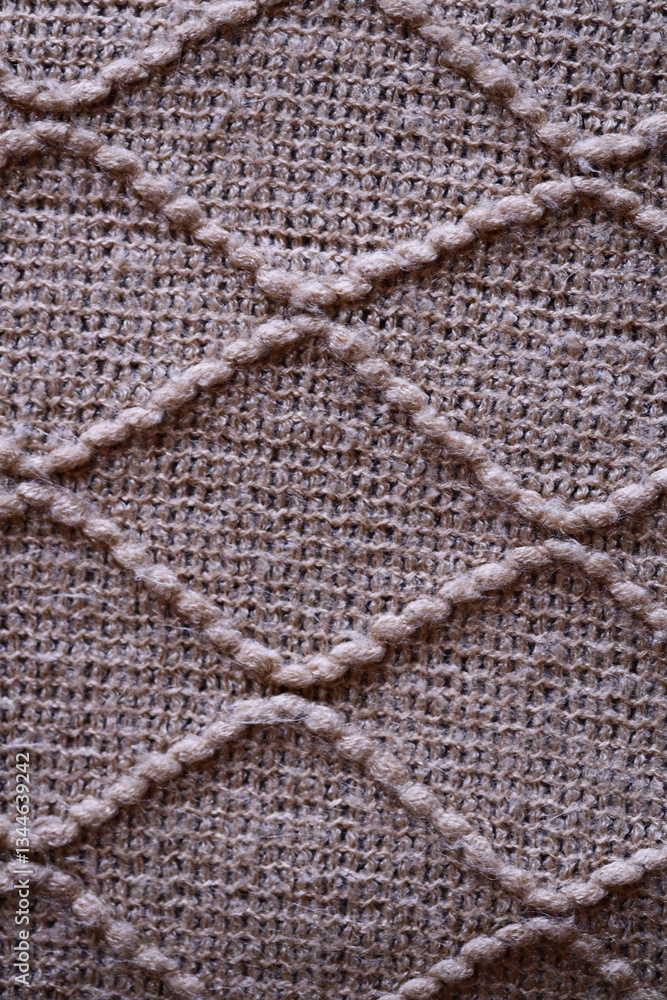 Poster a close-up view of a soft and cozy knitted blanket.