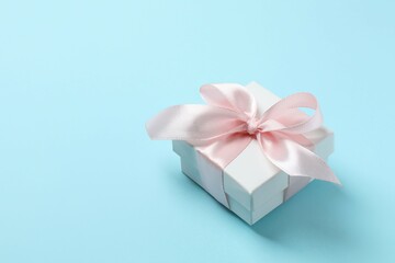 Beautiful gift box on color background