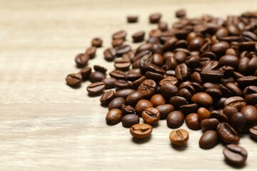 Coffee beans on wooden background