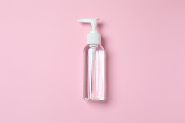 Natural cosmetic products. Cosmetic bottle on a pink background, top view