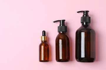 Natural cosmetic products a pink background, top view