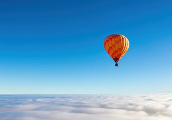 Obraz premium Colorful hot air balloon soaring above the clouds in a clear blue sky