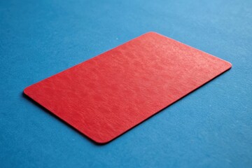 Red Card on Blue Background, Ideal for Mockups or Graphic Design Themes, Featuring Natural Texture and Isolated Shot