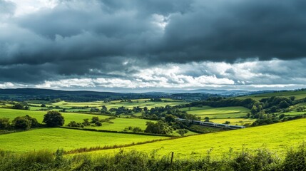 Obraz premium Rolling hills, dramatic clouds, rural landscape. Possible use for stock photography
