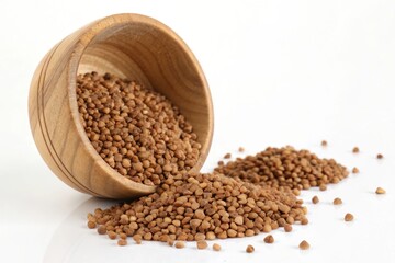 Buckwheat Grains Spilling from Wooden Bowl on White Background, Ideal for Food Photography or Healthy Eating Themes, Featuring Natural Texture and Nutritious Ingredient, Isolated Shot