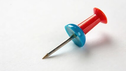 Red-blue pushpin on white background