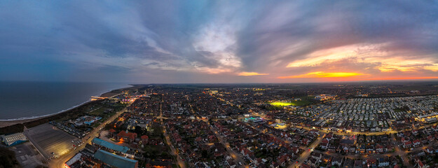 Panorama of the popular seaside holiday resort of Skegness on the east coast of england. Warm summer evening night time tones and sweeping vista views