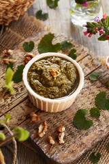 Pesto sauce made of fresh young garlic mustard leaves - a wild edible plant collected in early...