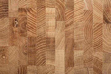 Oak wooden board as background, top view. Cross section of tree trunk. Natural durable end grain...
