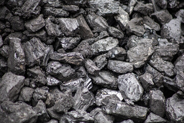 Close up of textured black coal stones background