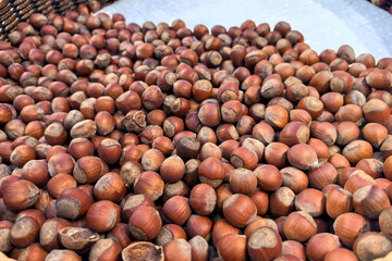 Hazelnuts displayed in a rustic market during the autumn harvest season