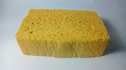 Yellow sponge isolated with white background 